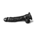 9.7 inch black dildo laying on side