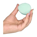 Beppy dry menstrual sponge in a womans hand showing size.
