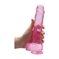 real rock 9 inch pink clear dildo in mans hand for size reference