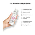 woman's hand holding booty silicone lubricant bottle with a list of features.