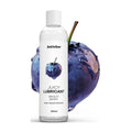 breezy berry lubricant bottle in front of a blueberry graphic