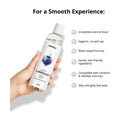 woman holding breezy berry 300 ml bottle with a list of features.