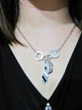 fifty shades of grey necklace, handcuffs, mask and tie 
